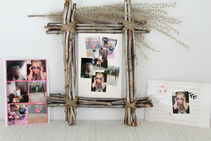 bricolaje marco de fotos decorado con ramas pequeñas, fotos de familia