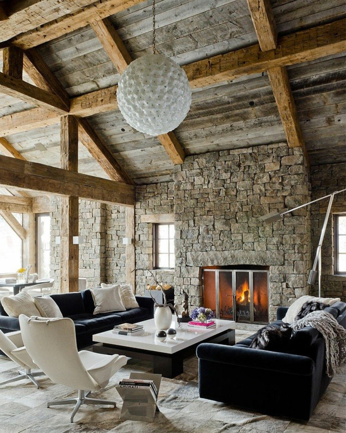 mobilier moderne, des murs en pierre intérieur rustique cheminée toit en bois