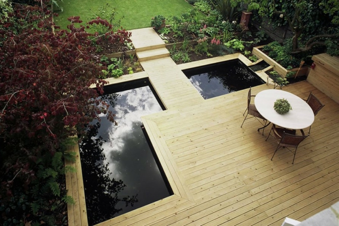 un moderno jardín frontal en la foto desde arriba - muebles de estanque y jardín, plantas verdes