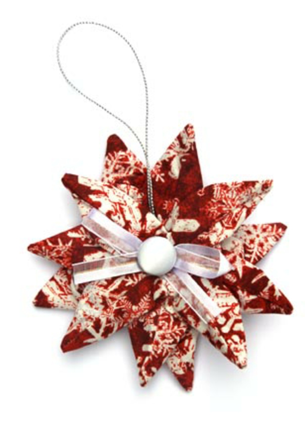 origami- से-क्रिसमस-सुंदर-स्टार - पृष्ठभूमि में सफेद