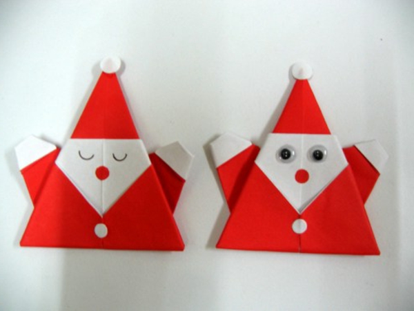 origami-joulu-santa-claus valkoisella seinällä