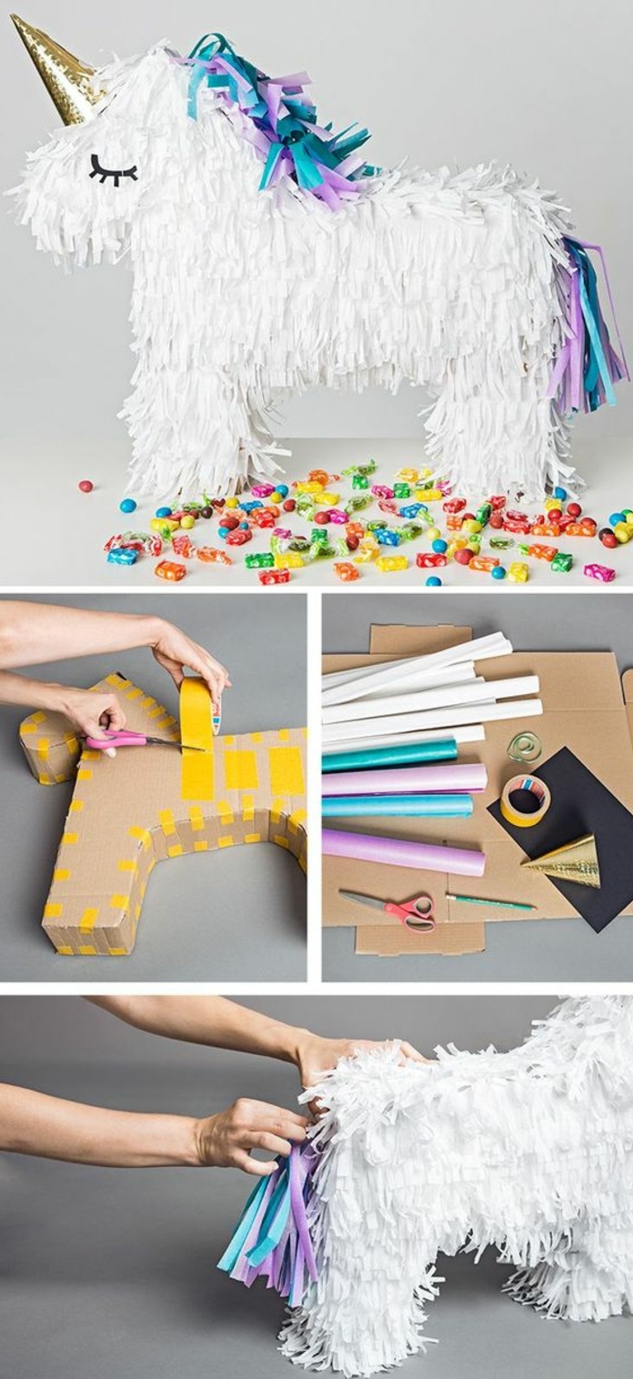 unicornio hecho de cartón, dulces, papel blanco, tijeras, cinta adhesiva