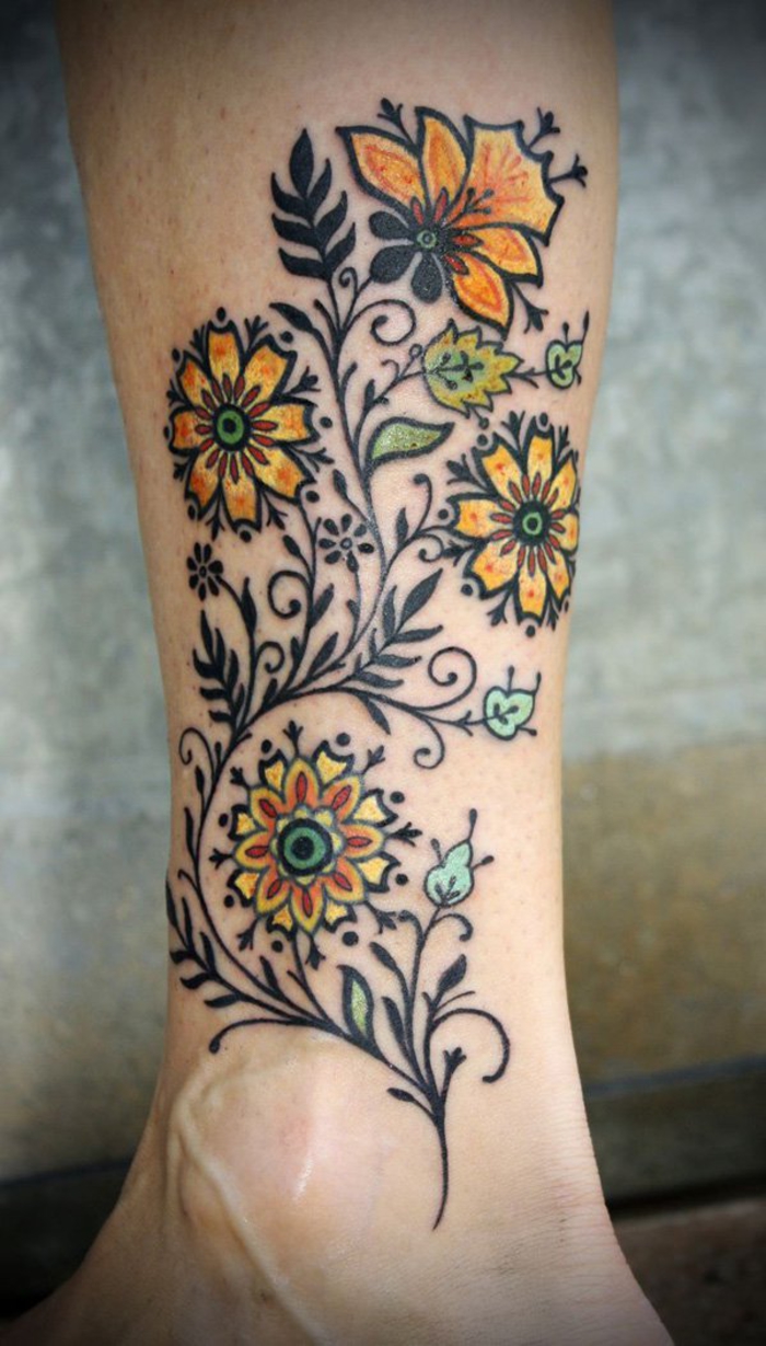 motivos de tatuajes para mujeres, tatuaje de piernas, flores, amarillo y negro